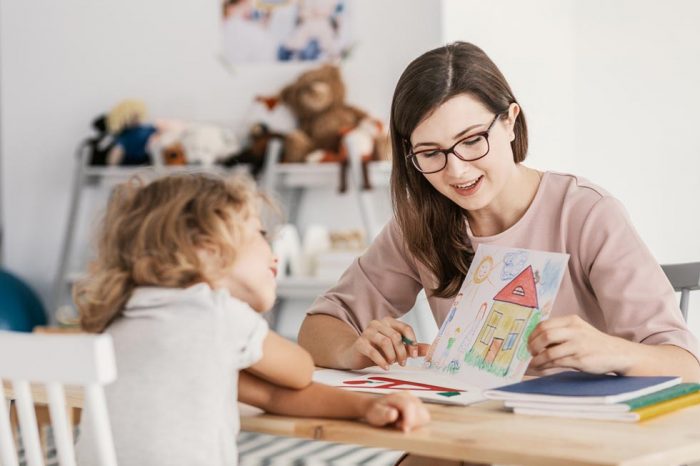 Woman providing social work to a child